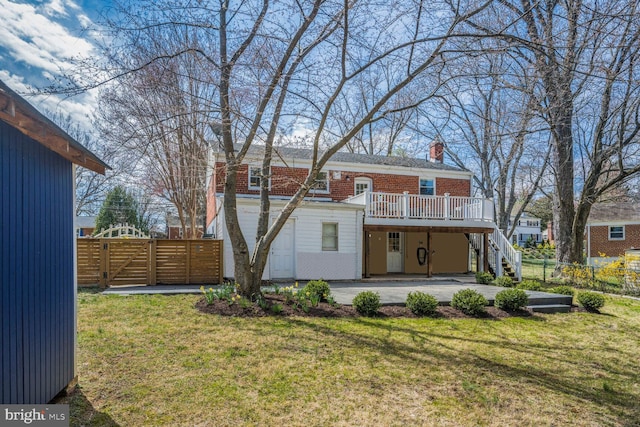 12011 Ashley Dr, Rockville, MD 20852 - rear view of house featuring a chimney, a deck, fence, a yard, and stairs