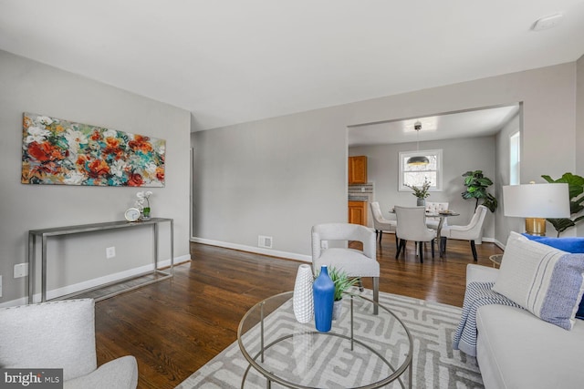 12011 Ashley Dr, Rockville, MD 20852 - living area featuring baseboards, visible vents, and wood finished floors