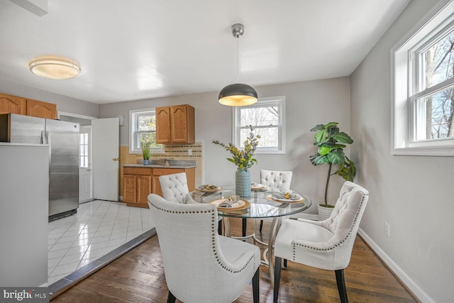 12011 Ashley Dr, Rockville, MD 20852 - dining room with baseboards and wood finished floors