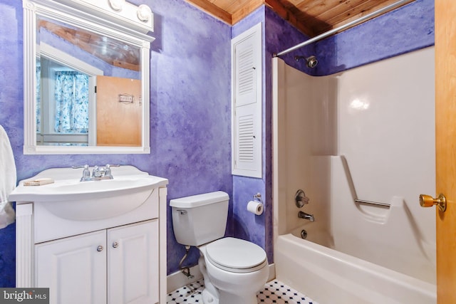 bathroom with vanity, tile patterned flooring, toilet, and bathing tub / shower combination