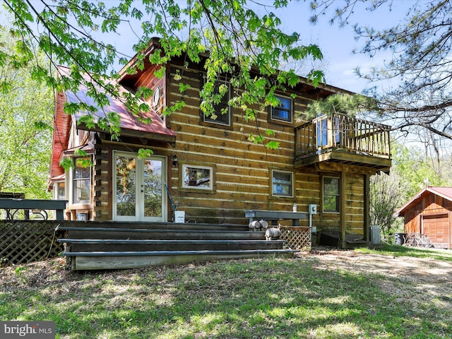 back of property featuring french doors and a deck