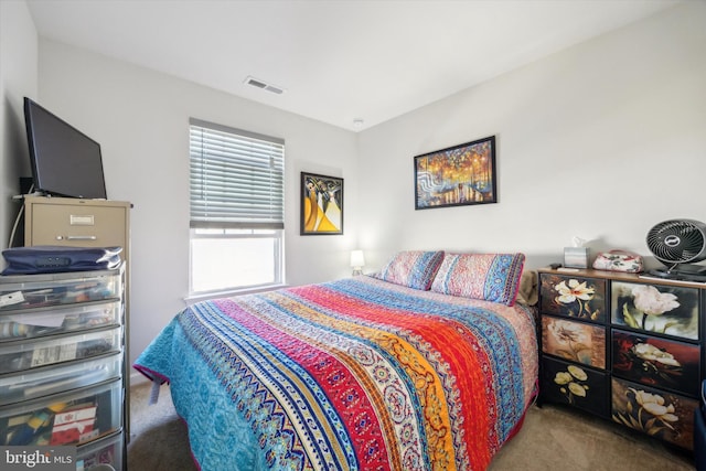 bedroom featuring visible vents and carpet flooring