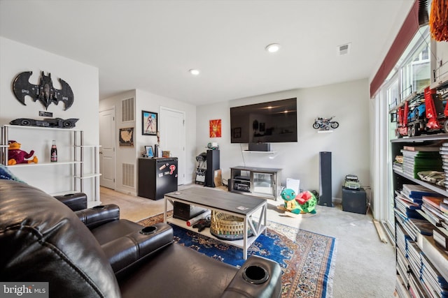 carpeted living room featuring visible vents