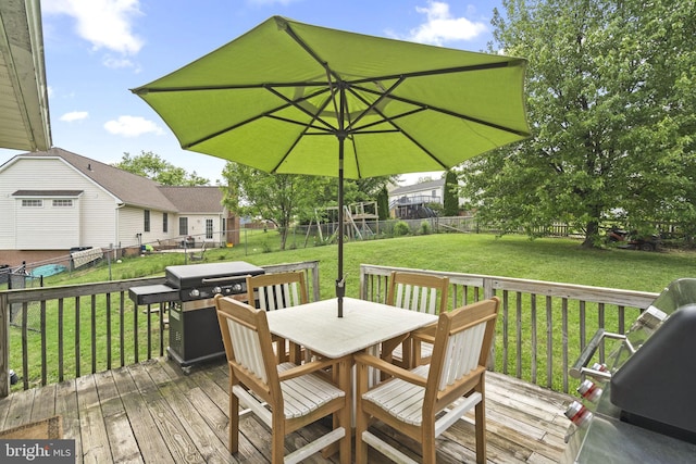deck with outdoor dining area and area for grilling