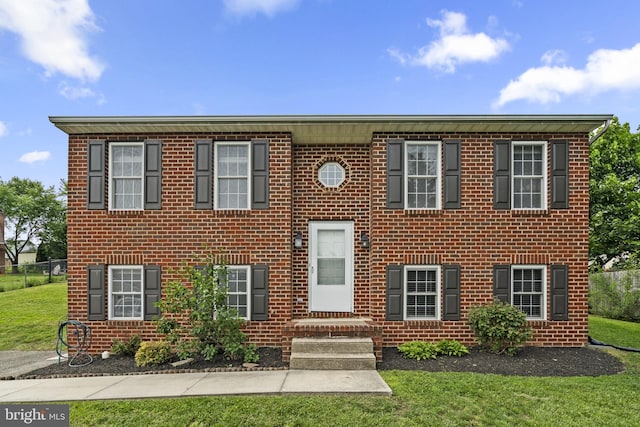 view of front of house with brick siding