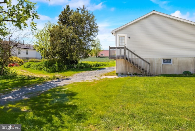 view of property exterior with a yard