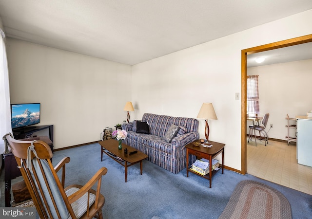 carpeted living room featuring baseboards