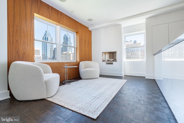 1830 Rittenhouse Sq Unit 17B, Philadelphia, PA 19103 - living area featuring baseboards, a city view, and wooden walls