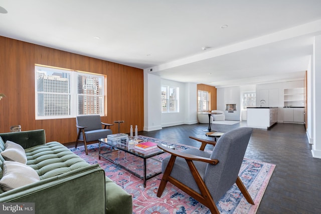 1830 Rittenhouse Sq Unit 17B, Philadelphia, PA 19103 - living room featuring baseboards and wood walls