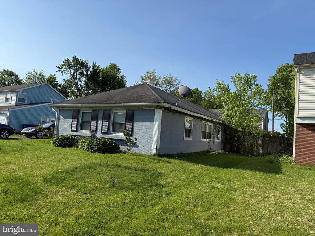 40 Madestone Ln, Willingboro, NJ 08046 - view of side of property featuring a lawn and brick siding