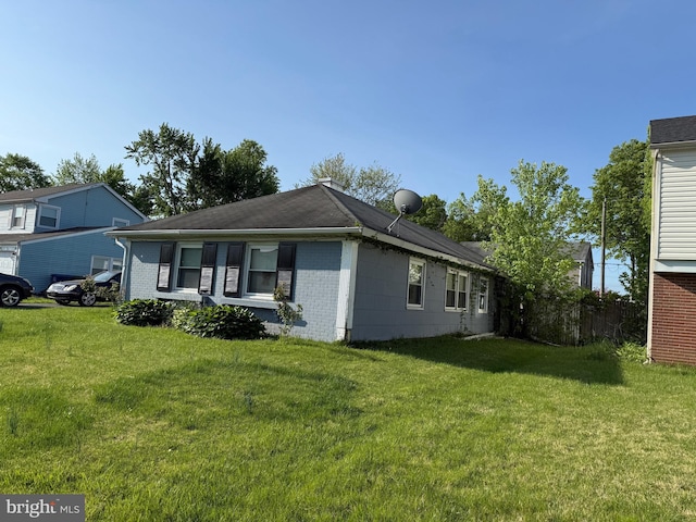 40 Madestone Ln, Willingboro, NJ 08046 - view of side of property featuring a lawn and brick siding