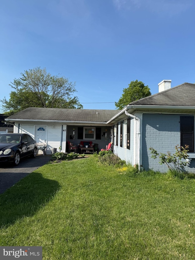 40 Madestone Ln, Willingboro, NJ 08046 - ranch-style house with a front lawn, brick siding, and driveway