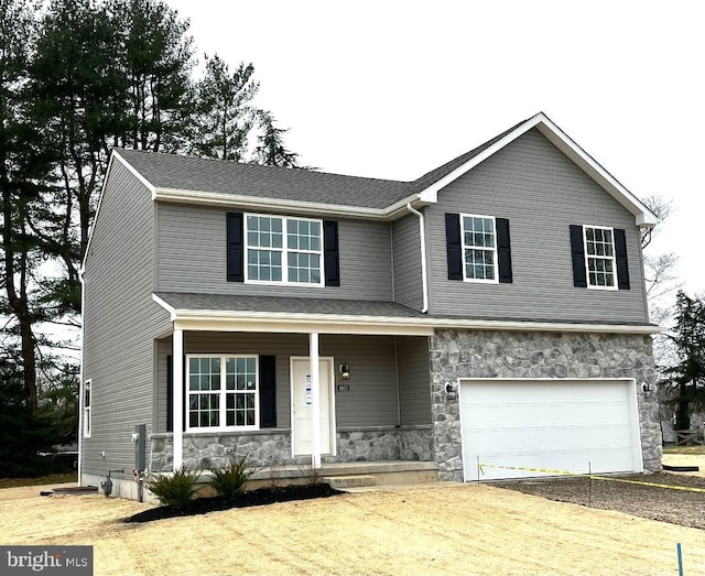 308 Nowland Ln, Delaware City, DE 19706 - traditional-style house featuring covered porch, dirt driveway, an attached garage, and stone siding