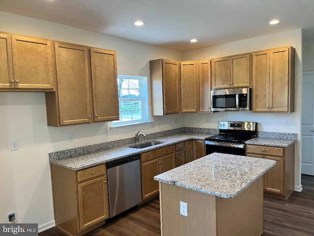 308 Nowland Ln, Delaware City, DE 19706 - kitchen with light stone countertops, dark wood-style floors, stainless steel appliances, and a sink