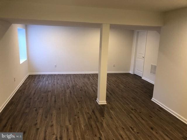 308 Nowland Ln, Delaware City, DE 19706 - basement featuring baseboards and dark wood-type flooring