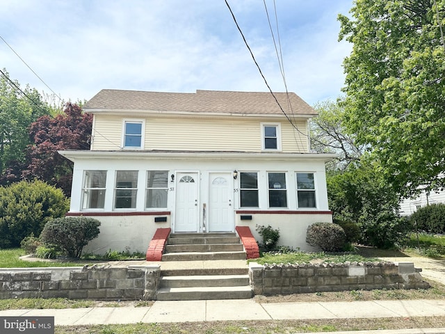 traditional-style home featuring entry steps