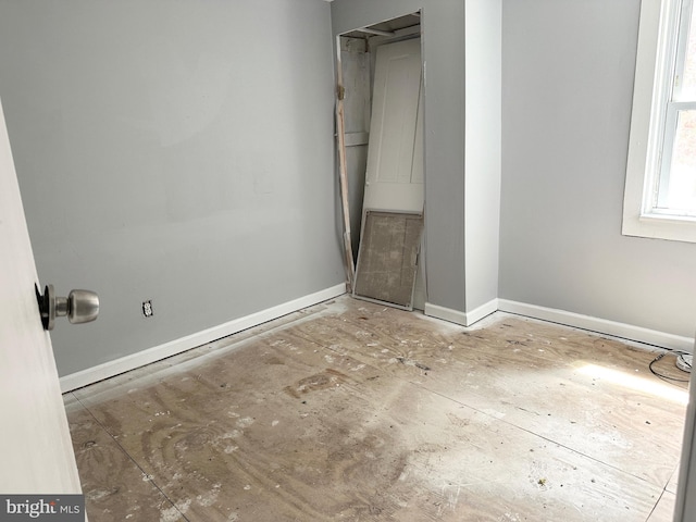 unfurnished bedroom with baseboards