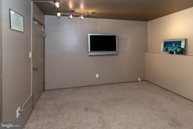 empty room with carpet flooring and baseboards