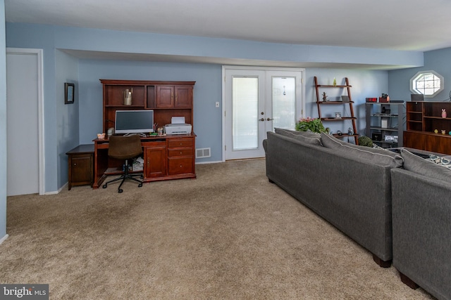 living room with carpet flooring, visible vents, and french doors