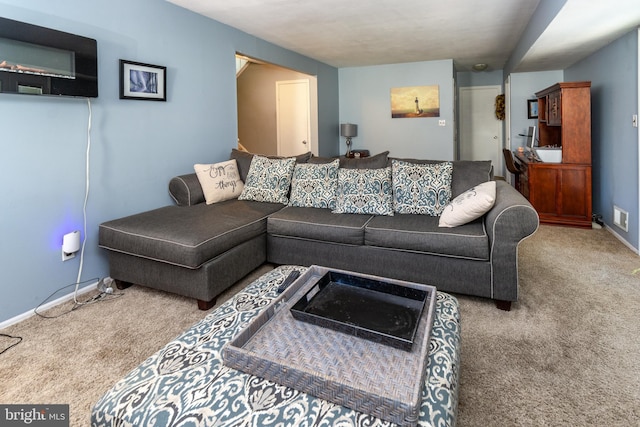 living room with baseboards and carpet floors