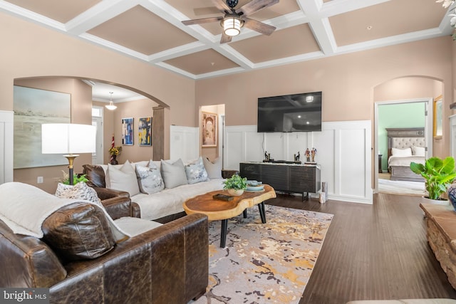 3058 Sunny Ridge Dr, Odenton, MD 21113 - living area featuring arched walkways, coffered ceiling, a ceiling fan, a decorative wall, and wainscoting
