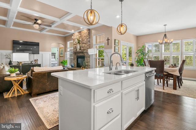 3058 Sunny Ridge Dr, Odenton, MD 21113 - kitchen featuring a sink, a stone fireplace, open floor plan, stainless steel dishwasher, and a ceiling fan