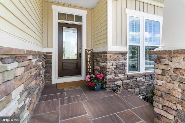 3058 Sunny Ridge Dr, Odenton, MD 21113 - doorway to property featuring stone siding, board and batten siding, and a porch