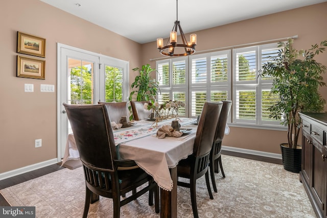 3058 Sunny Ridge Dr, Odenton, MD 21113 - dining room featuring a chandelier, baseboards, and light wood-style flooring