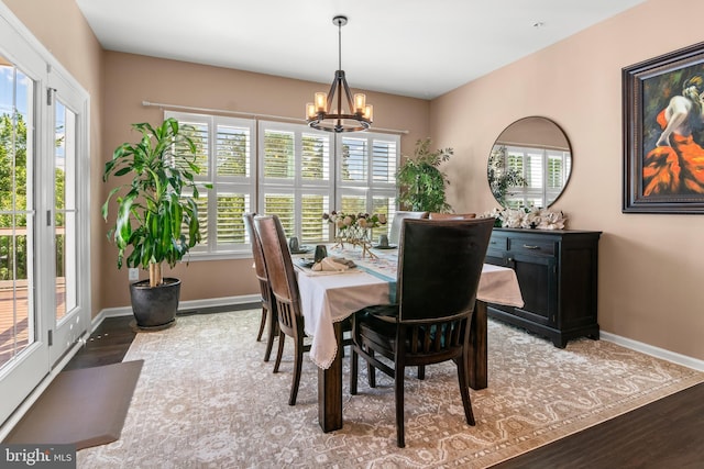 3058 Sunny Ridge Dr, Odenton, MD 21113 - dining space featuring wood finished floors, a chandelier, and plenty of natural light