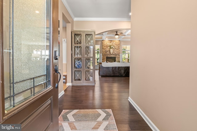 3058 Sunny Ridge Dr, Odenton, MD 21113 - foyer entrance featuring ornamental molding, a ceiling fan, dark wood-style floors, a stone fireplace, and baseboards