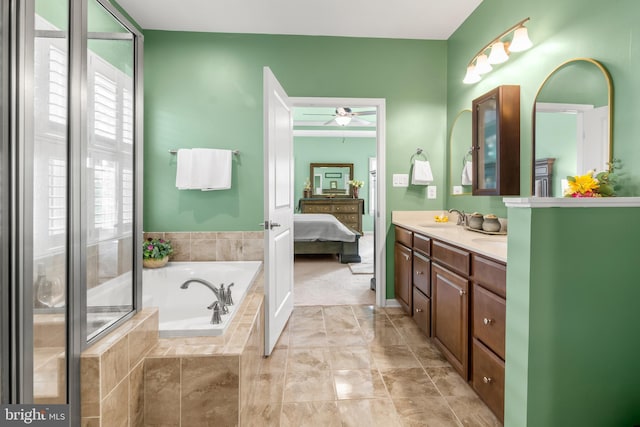 3058 Sunny Ridge Dr, Odenton, MD 21113 - ensuite bathroom featuring a garden tub, a ceiling fan, and double vanity