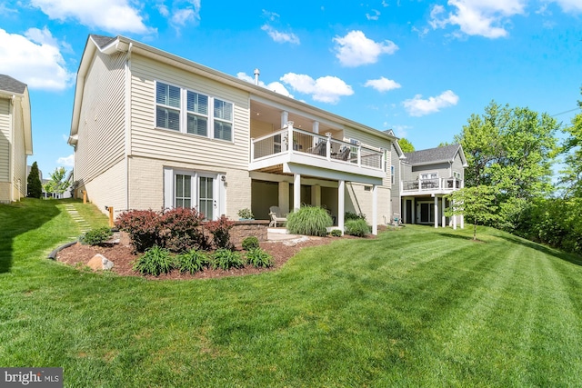 3058 Sunny Ridge Dr, Odenton, MD 21113 - rear view of property featuring a balcony, a yard, brick siding, and a patio area
