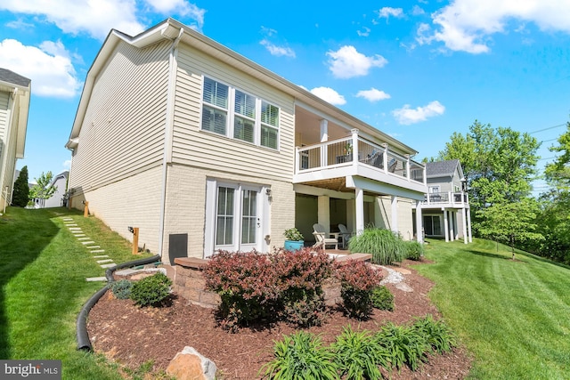 3058 Sunny Ridge Dr, Odenton, MD 21113 - rear view of property with a balcony, a yard, a patio, and brick siding