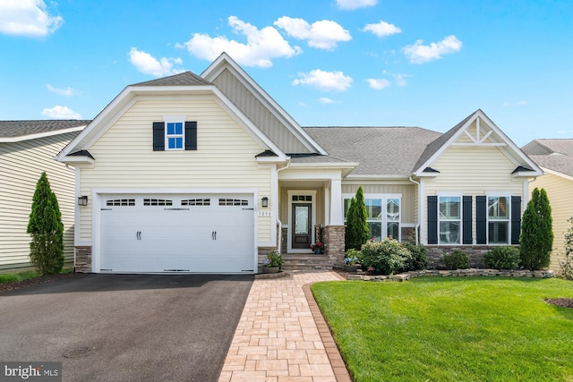 3058 Sunny Ridge Dr, Odenton, MD 21113 - craftsman-style home featuring board and batten siding, asphalt driveway, stone siding, a front lawn, and a shingled roof