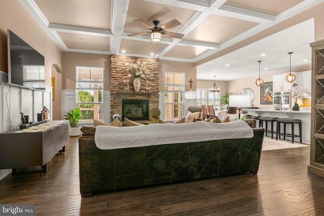 3058 Sunny Ridge Dr, Odenton, MD 21113 - living area featuring a fireplace, a ceiling fan, coffered ceiling, beamed ceiling, and dark wood-style flooring