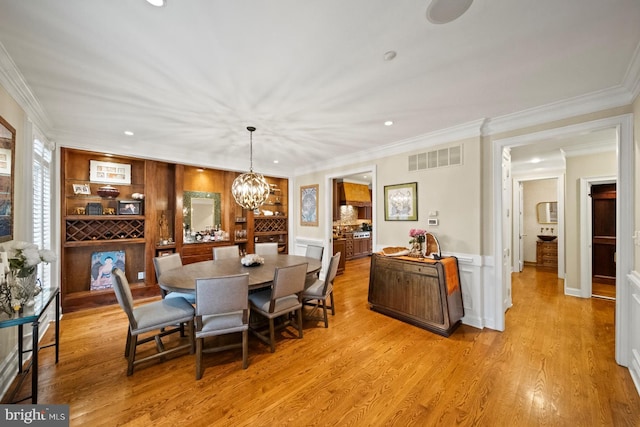 dining room with crown molding, recessed lighting, a notable chandelier, and visible vents
