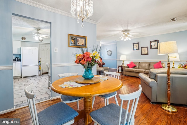10114 Erin Ct, Manassas, VA 20110 - dining area with ceiling fan, ornamental molding, light wood finished floors, and visible vents