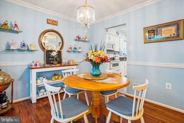 10114 Erin Ct, Manassas, VA 20110 - dining room with baseboards, an inviting chandelier, ornamental molding, and wood finished floors