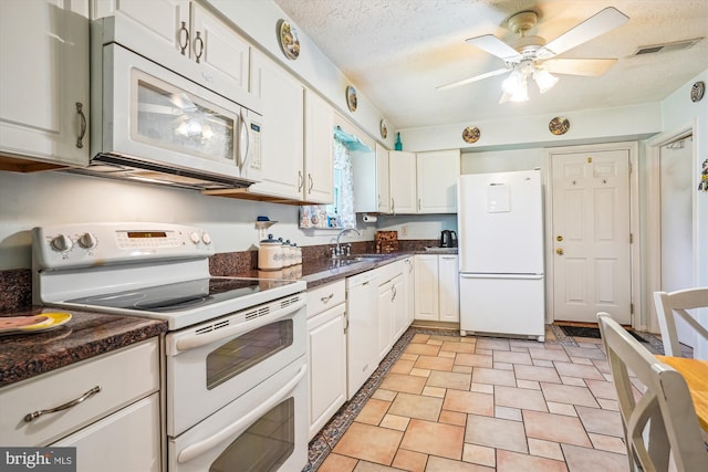 10114 Erin Ct, Manassas, VA 20110 - kitchen with visible vents, white appliances, ceiling fan, white cabinetry, and a sink