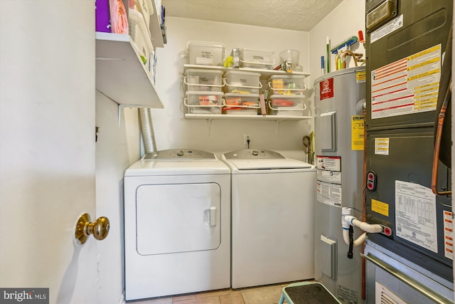 10114 Erin Ct, Manassas, VA 20110 - clothes washing area featuring laundry area, tile patterned flooring, heating unit, independent washer and dryer, and water heater