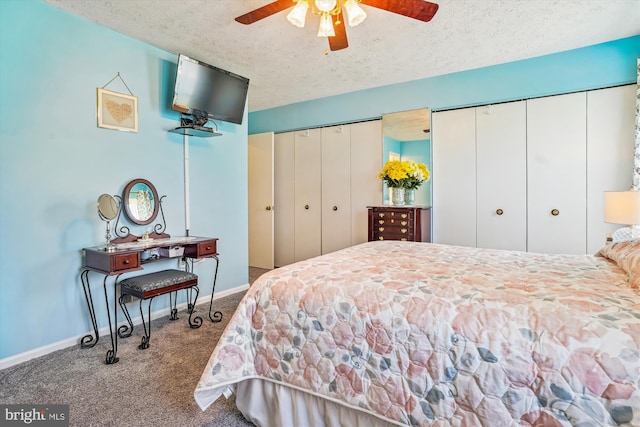 10114 Erin Ct, Manassas, VA 20110 - carpeted bedroom with two closets, a textured ceiling, baseboards, and ceiling fan