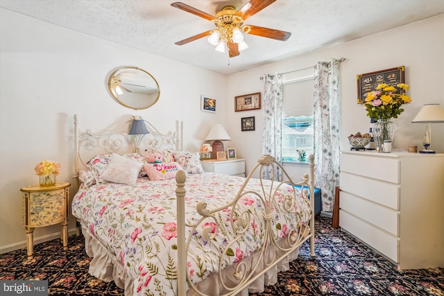 10114 Erin Ct, Manassas, VA 20110 - bedroom featuring carpet floors, a ceiling fan, a textured ceiling, and baseboards