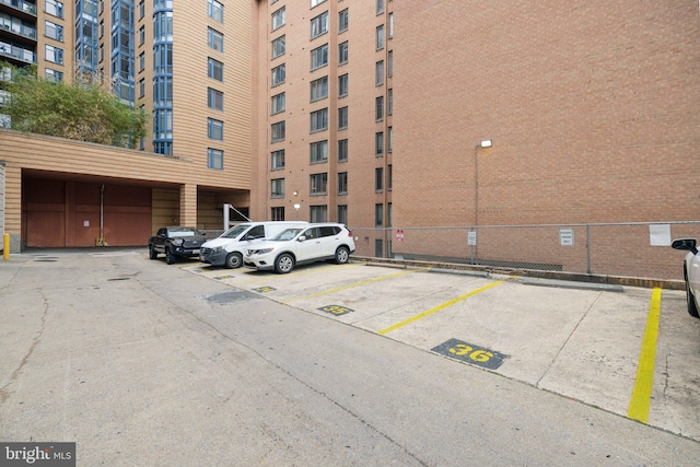 view of building exterior featuring uncovered parking