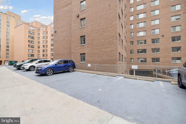 view of property with uncovered parking