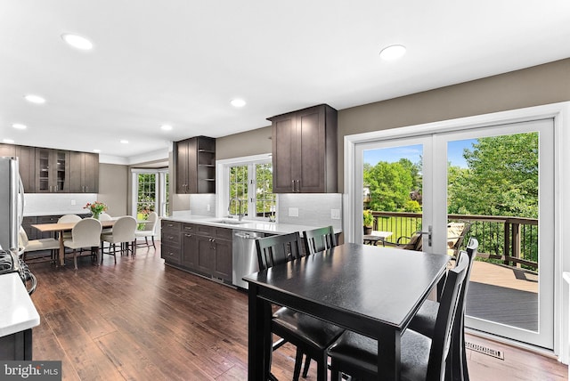dining space with recessed lighting and dark wood finished floors