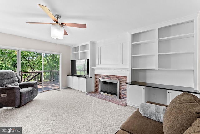 living area with ceiling fan, a fireplace, and light carpet