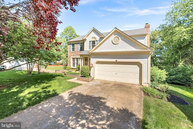 traditional-style house with driveway, a chimney, a front lawn, and a garage