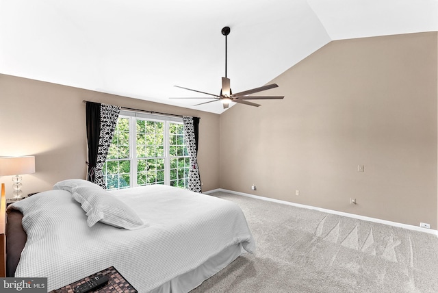 bedroom with vaulted ceiling, carpet floors, baseboards, and ceiling fan