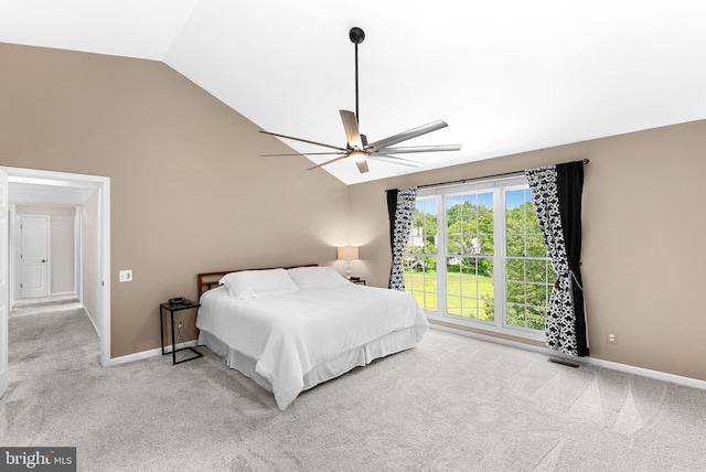 bedroom with lofted ceiling, carpet flooring, baseboards, and a ceiling fan