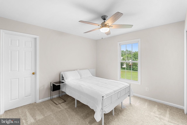 bedroom featuring carpet flooring, baseboards, and a ceiling fan